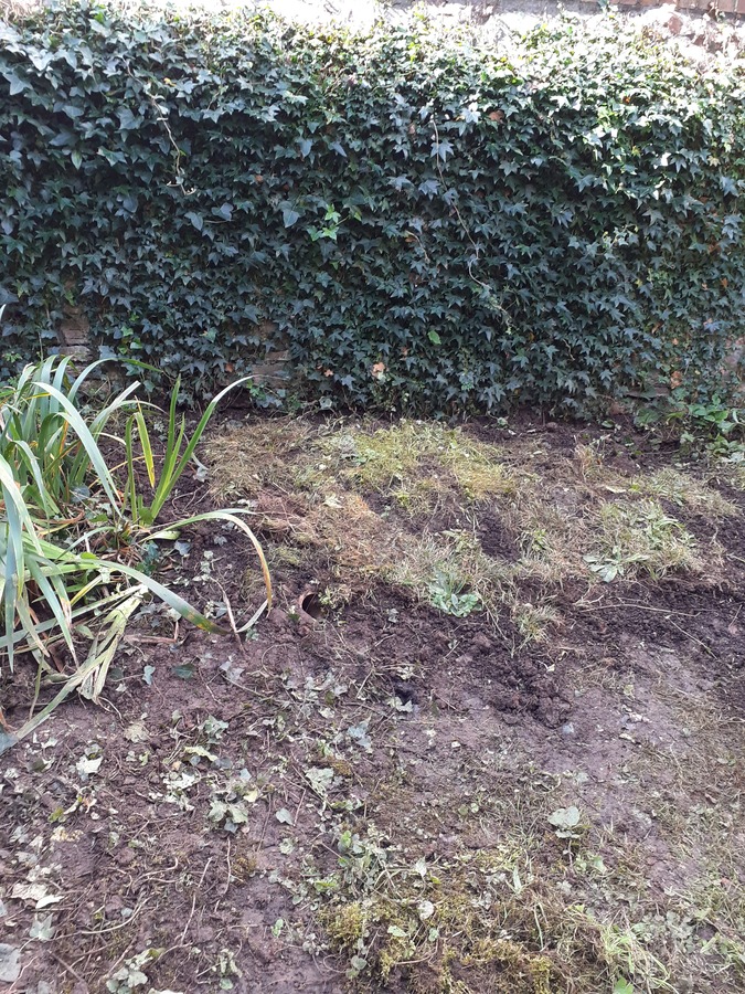 8. All the soil which was dug out was put back on top of the stone and branches. We tapped it down firmly and then laid the turf we had removed on top. 